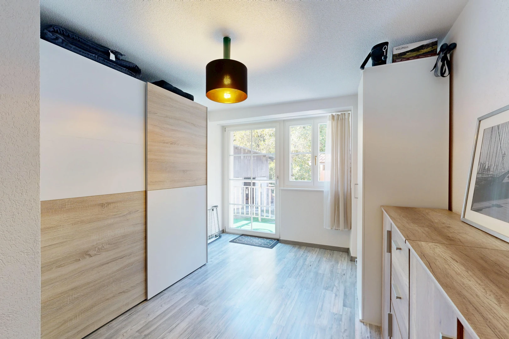 kitchen featuring access to exterior, light wood-style flooring, wooden counters, modern cabinets, and light wood finish cabinetry