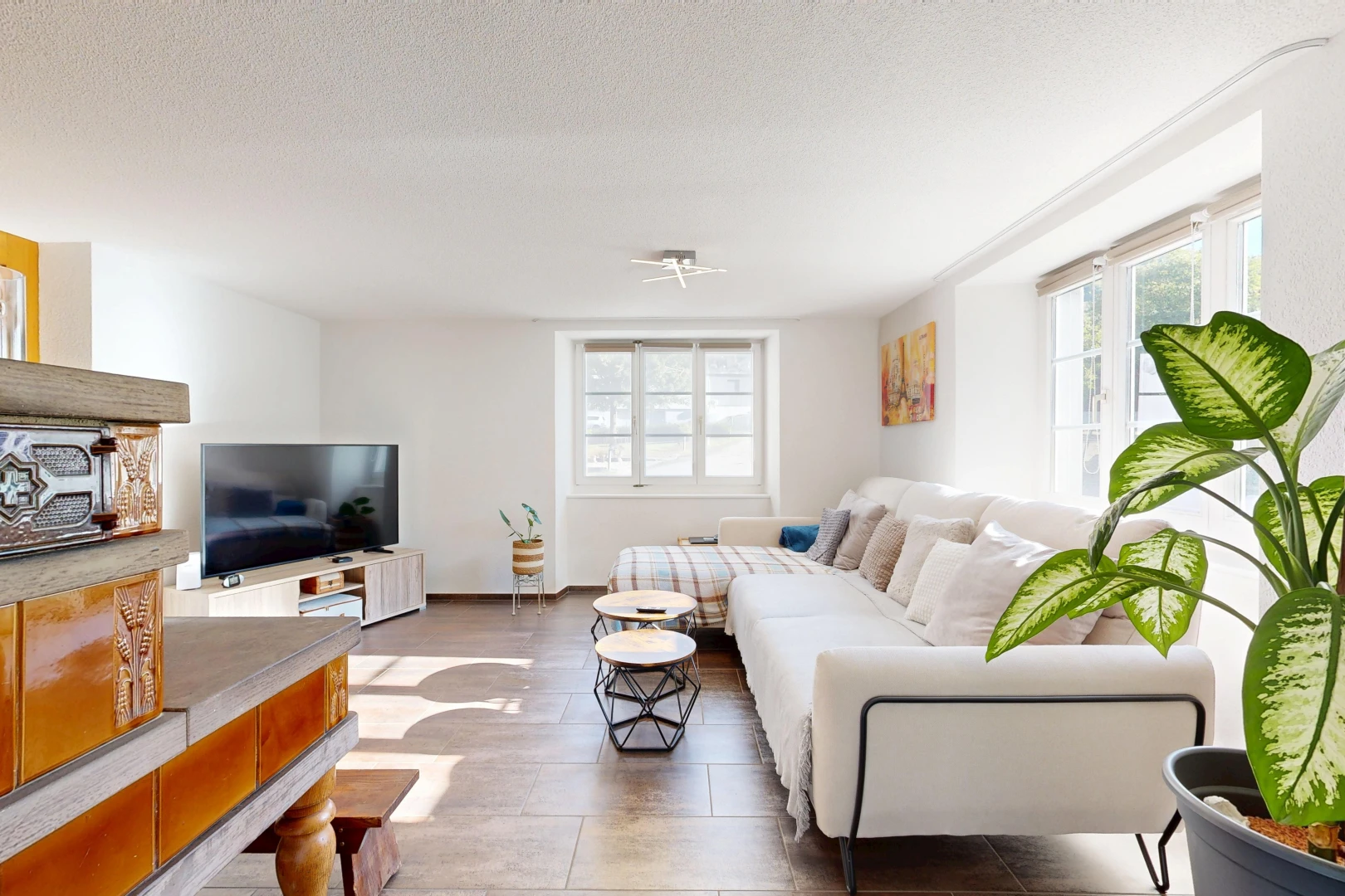 living area with healthy amount of natural light and a textured ceiling