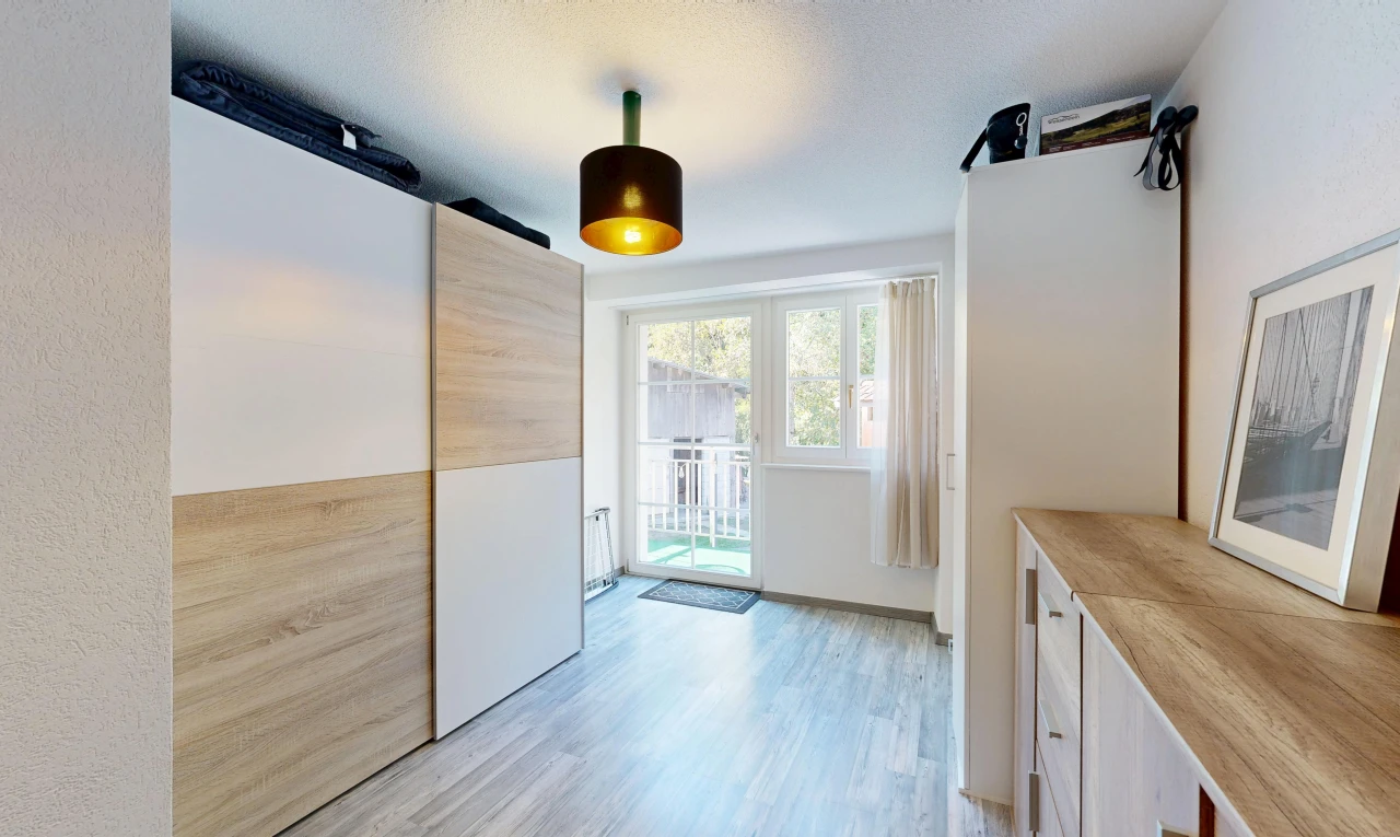 kitchen featuring access to exterior, light wood-style flooring, wooden counters, modern cabinets, and light wood finish cabinetry