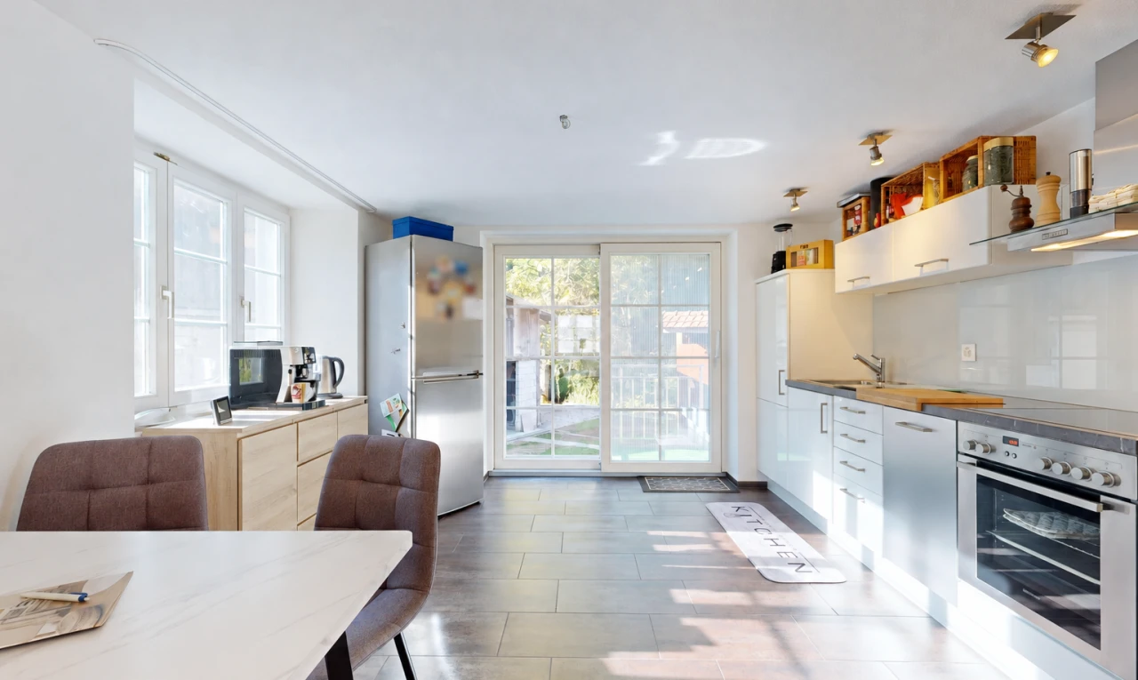 kitchen with stainless steel appliances, access to outside, extractor fan, and white cabinets