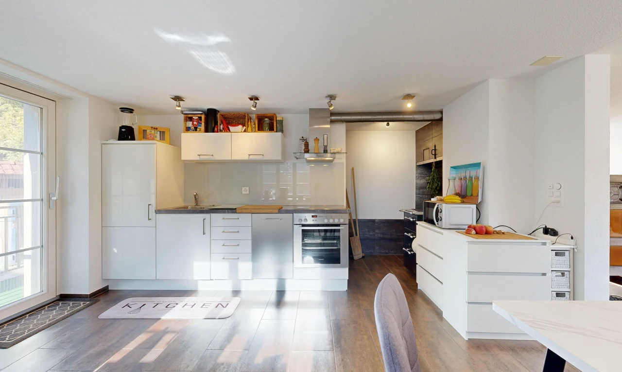 kitchen with oven, access to exterior, white microwave, white cabinets, and dark wood-style flooring