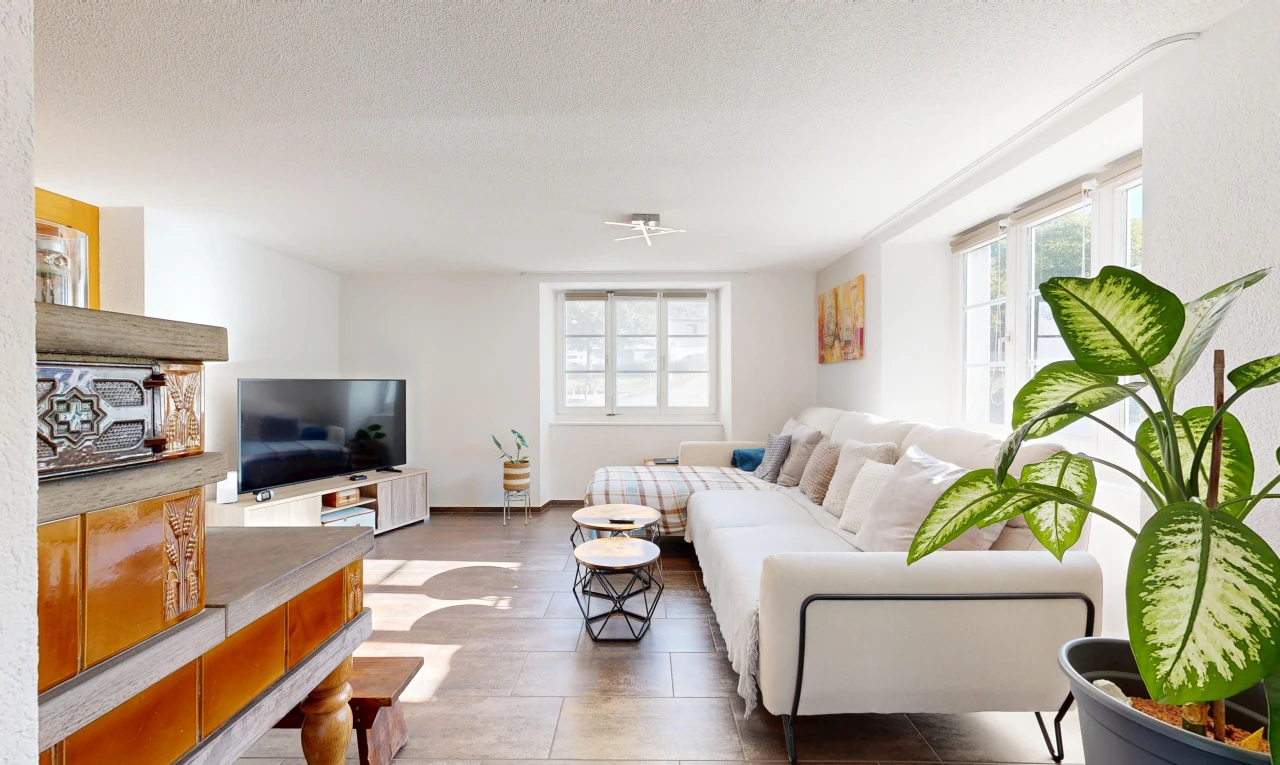 living area with healthy amount of natural light and a textured ceiling