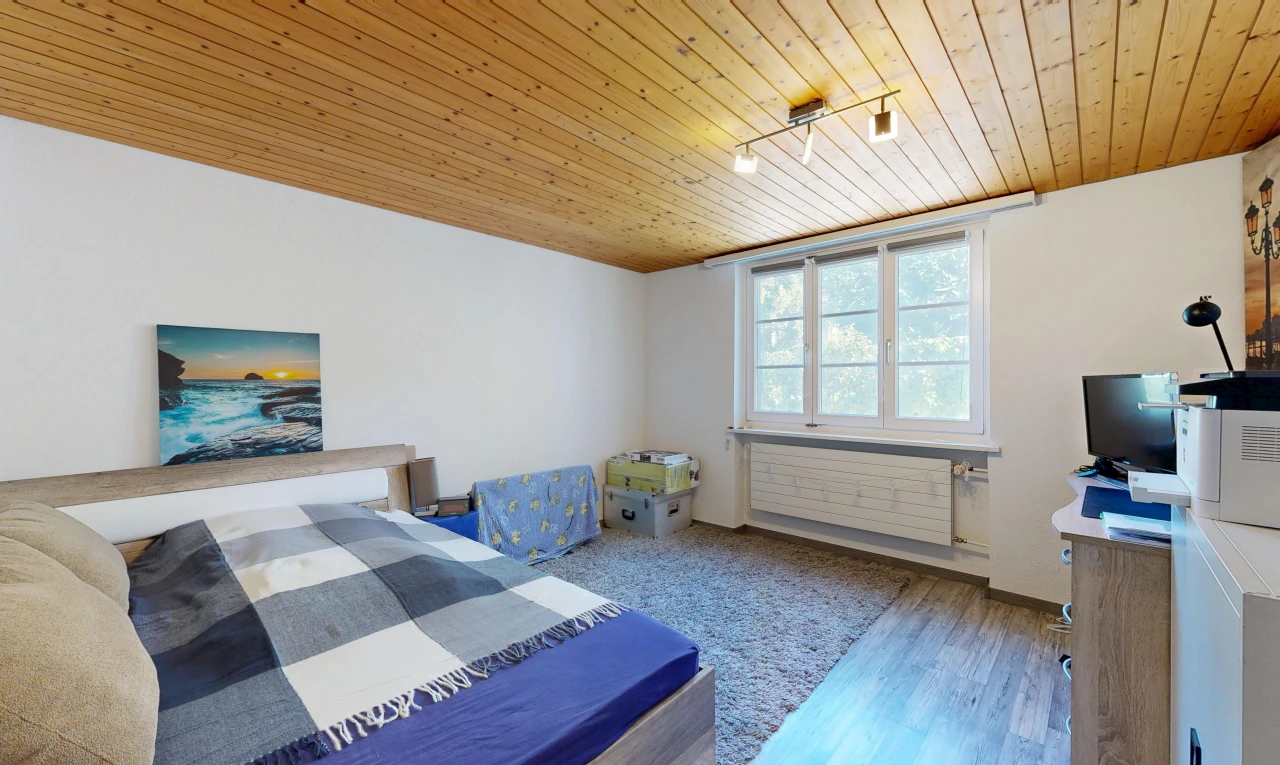 room / bedroom featuring wood ceiling, track lighting, and wood finished floors