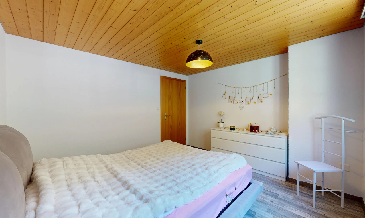 room / bedroom featuring wood ceiling, light wood-type flooring, and pendant lighting