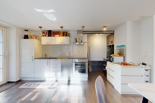 kitchen with oven, access to exterior, white microwave, white cabinets, and dark wood-style flooring