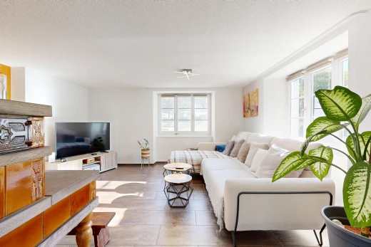living area with healthy amount of natural light and a textured ceiling