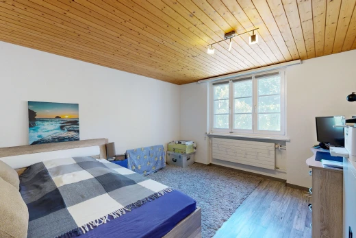 room / bedroom featuring wood ceiling, track lighting, and wood finished floors