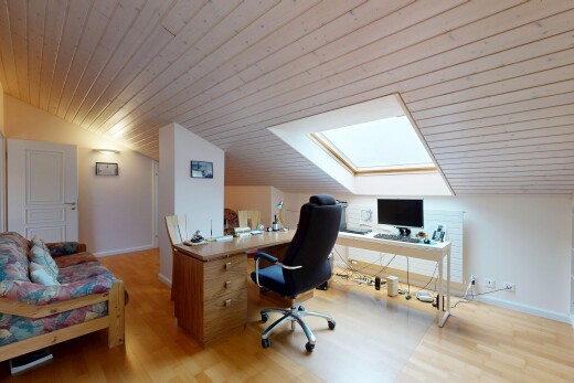 home office with lofted ceiling, a skylight, light wood-style floors, and wooden ceiling