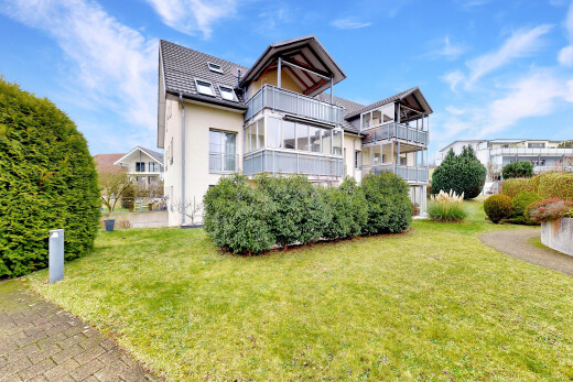 garden featuring a yard and a balcony