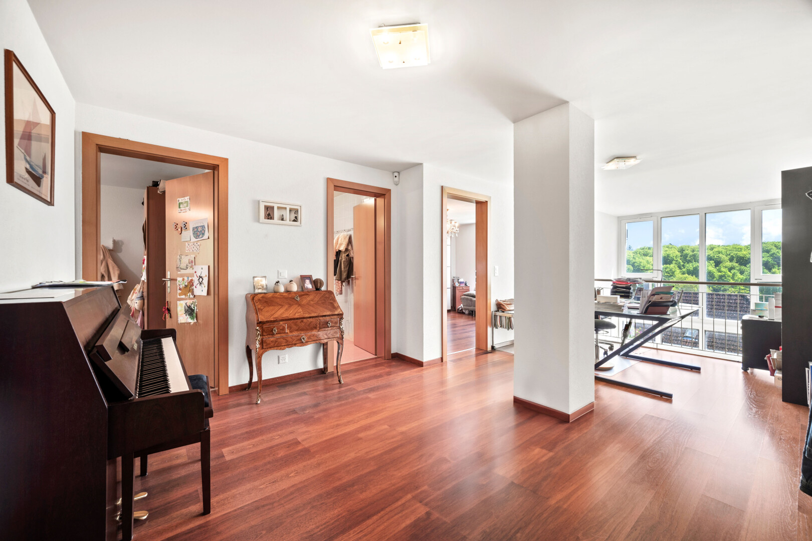 gym featuring wood finished floors and floor to ceiling windows