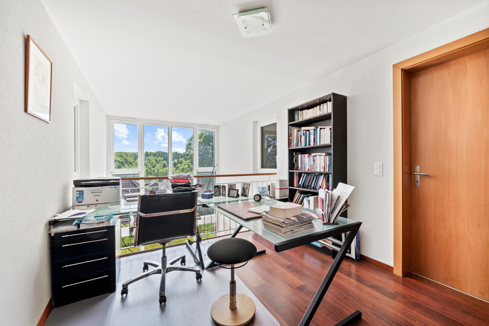 office featuring dark wood finished floors and a wall of windows