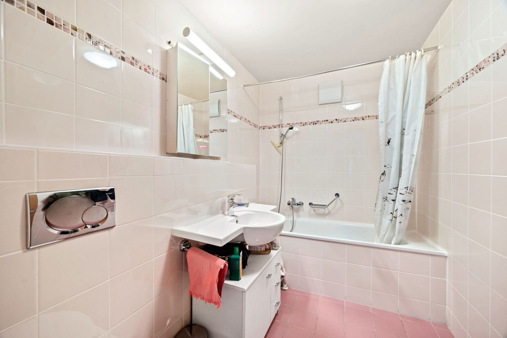 bathroom with vanity, tile walls, tiled shower / bath, and tile patterned flooring