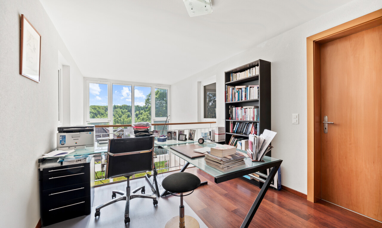 office featuring dark wood finished floors and a wall of windows
