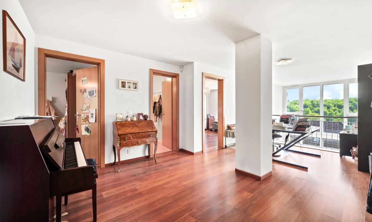 gym featuring wood finished floors and floor to ceiling windows