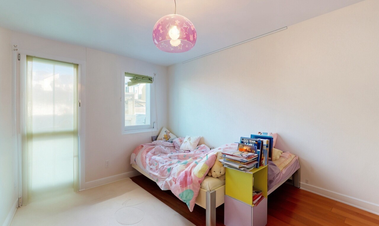 room / bedroom featuring baseboards and wood finished floors