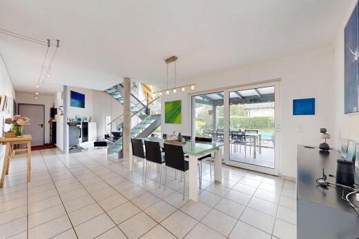dining room with stairway and light tile patterned floors