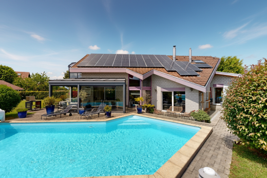 outdoor pool with a patio area