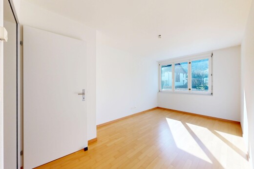 leerer raum mit inside property, gipskartonwand, drywall, holzfußboden, und wood finish floor