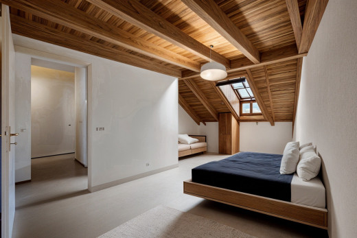 zimmer / schlafzimmer mit teppich, balkendecke, natürliches licht, dachfenster, und holzdecke