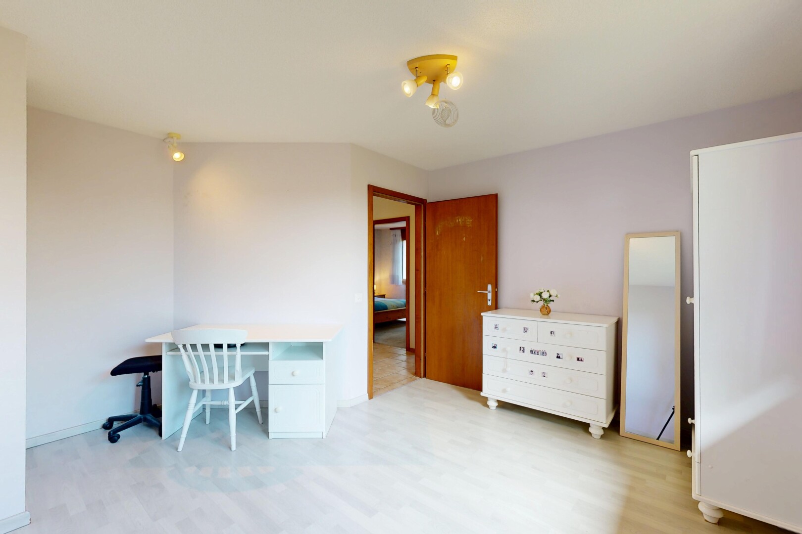 room / bedroom featuring a desk and light wood-style flooring