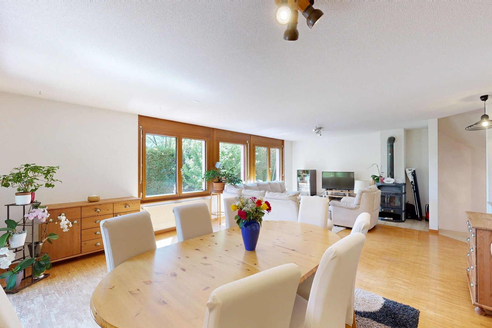 dining space featuring light wood-style flooring and decorative light fixtures