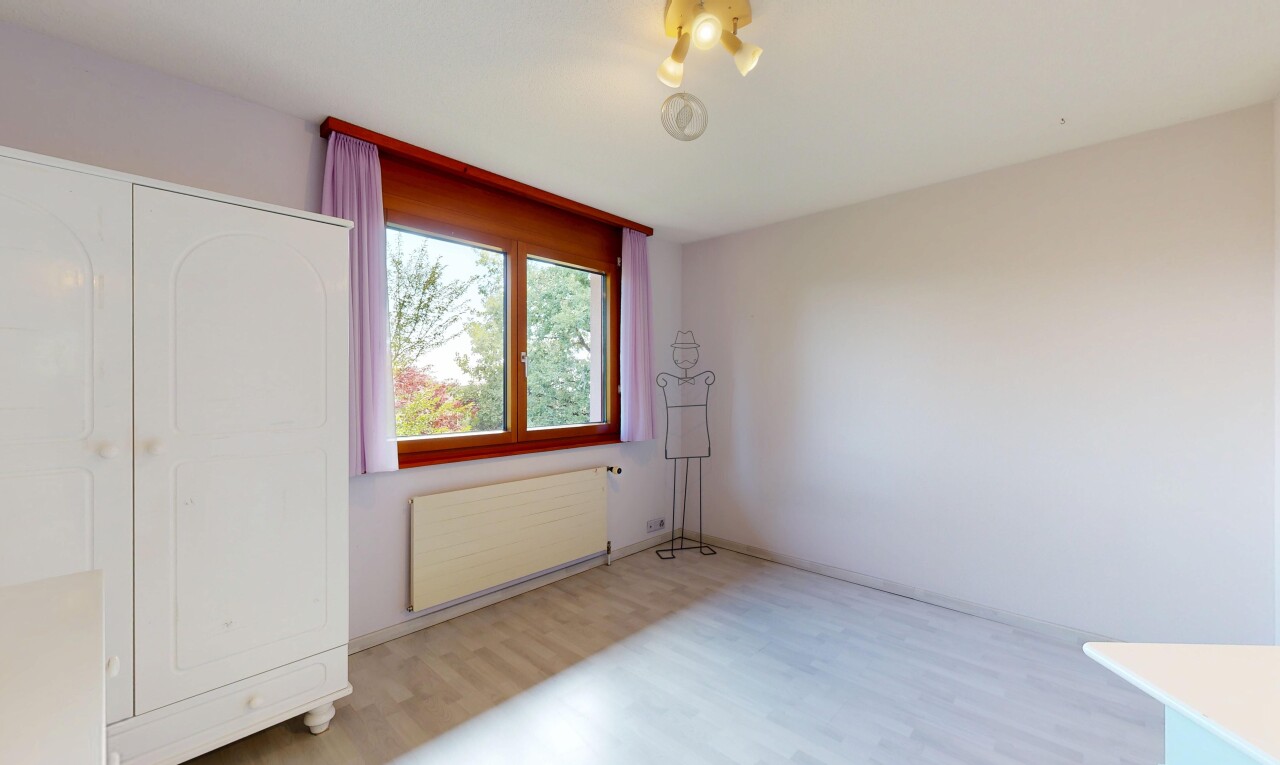 spare room with radiator and light wood-type flooring