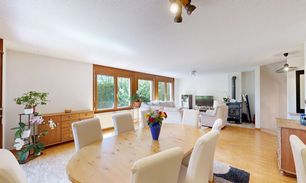 dining space featuring light wood-style flooring and decorative light fixtures