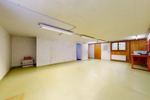 unfurnished room featuring radiator heating unit and concrete flooring