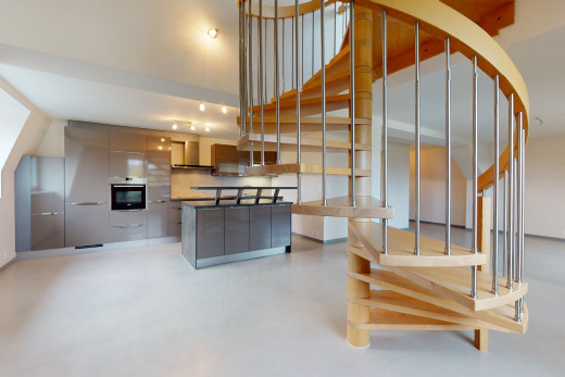 küche mit edelstahlofen, auspuffhaube und helle böden