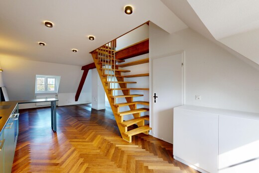 escaliers avec parquet floor, drywall, cloison sèche, natural light, et lumière naturelle