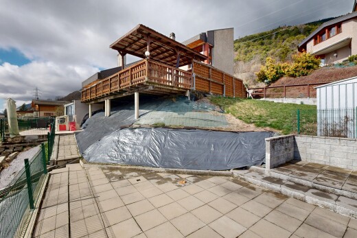 view of property with a patio and a wooden deck