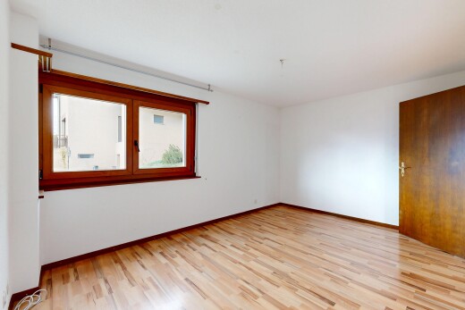 empty room featuring light wood finished floors and baseboards