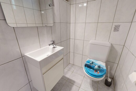 bathroom with vanity, tile walls, and light tile patterned floors