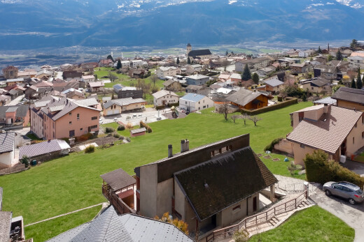 view of mountain backdrop featuring nearby suburban area