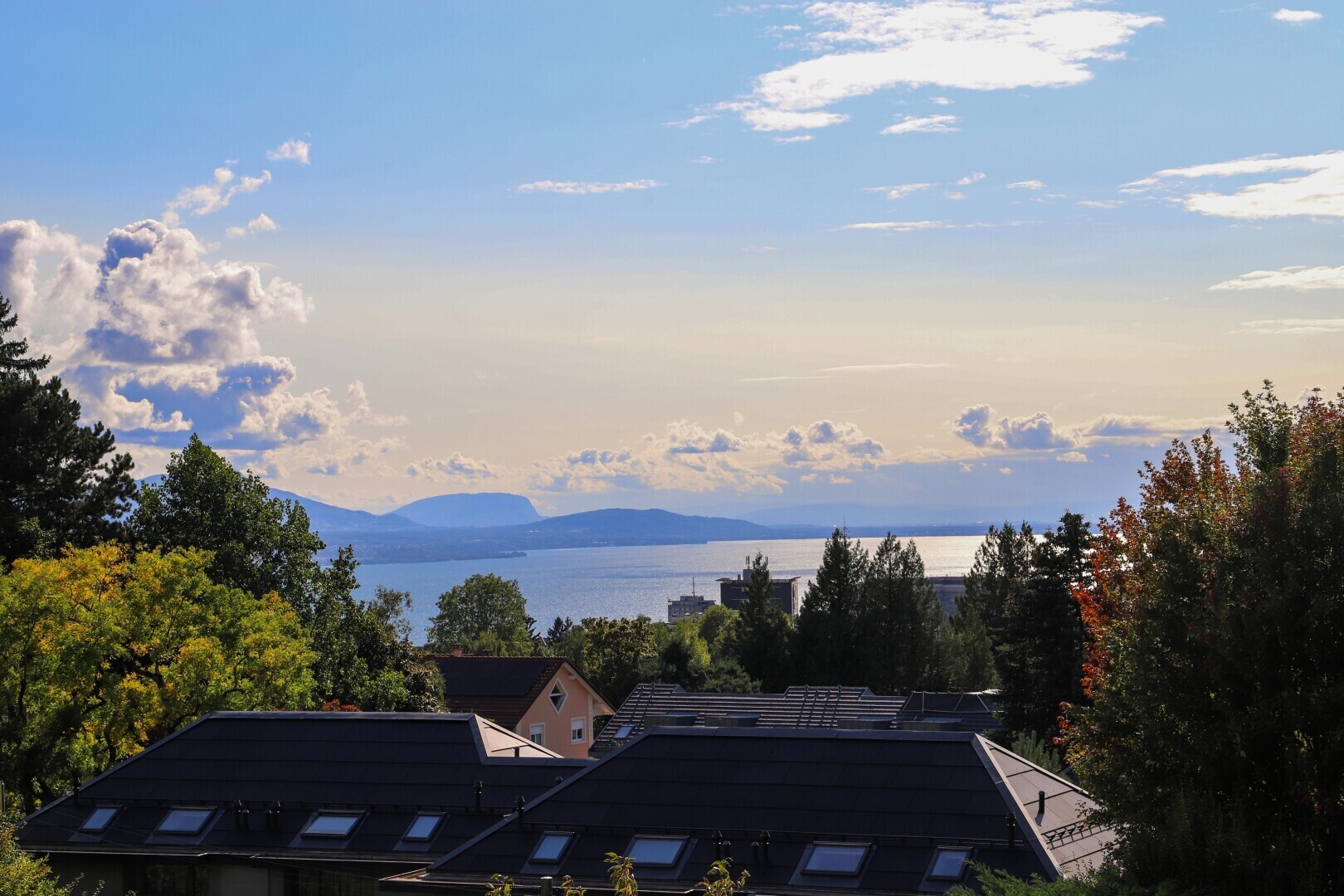 view of mountain background featuring a nearby body of water