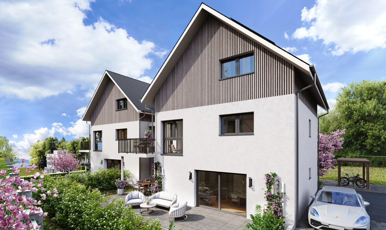 view of home featuring board and batten siding, a balcony, and a patio area