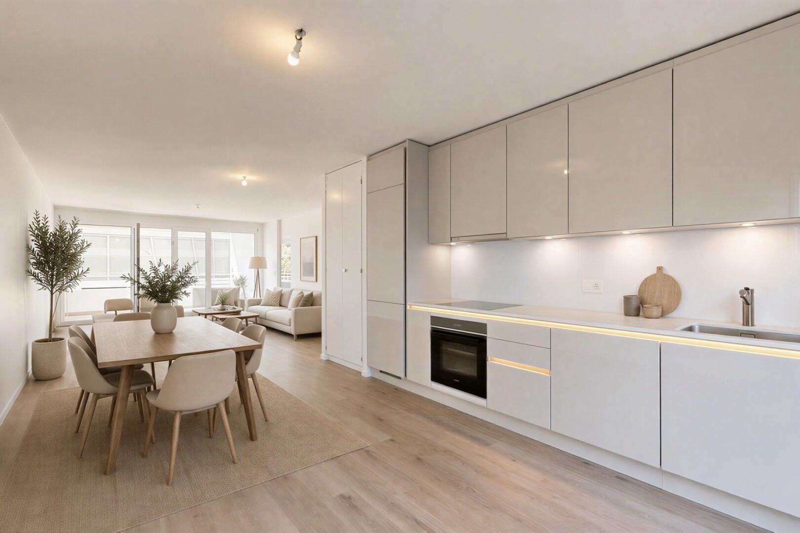 cuisine avec armoires à panneau plat, flat panel cabinets, light floor, plans de travail, et light countertops