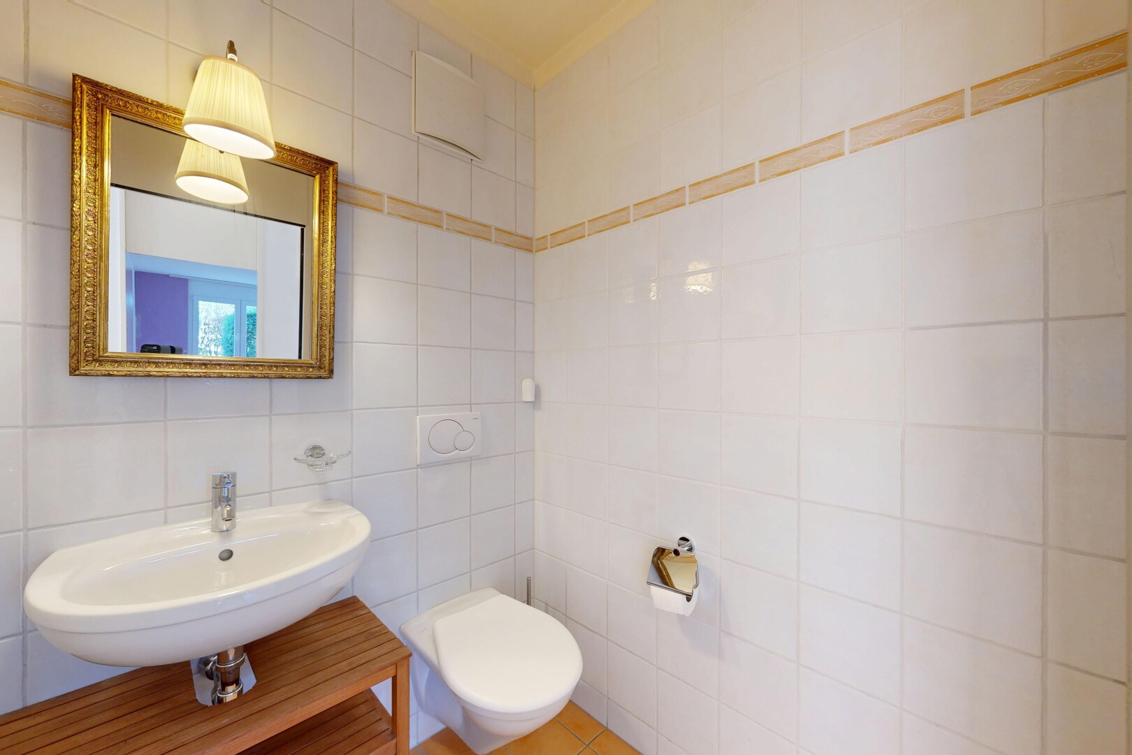 half bath featuring tile walls