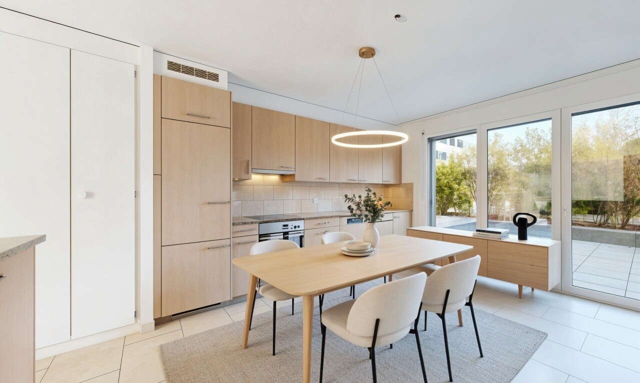 kitchen featuring light wood finish cabinets, hanging light fixtures, oven, tasteful backsplash, and light tile patterned floors