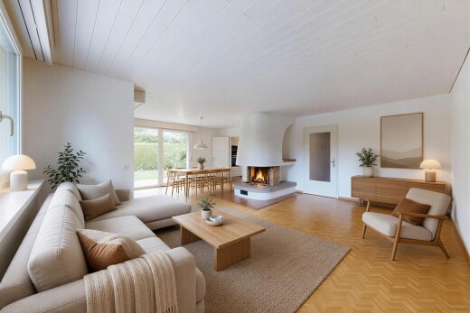 salon avec inside property, cloison sèche, drywall, sol en finition bois, et wood finish floor