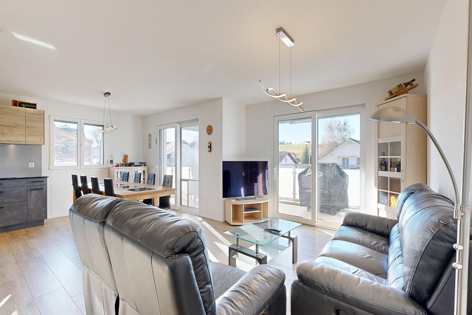 living / dining room with light wood-style flooring
