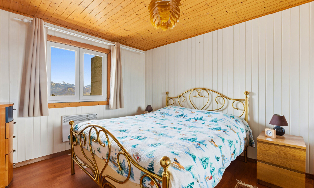 room with wooden walls, dark wood-style flooring, and wood ceiling