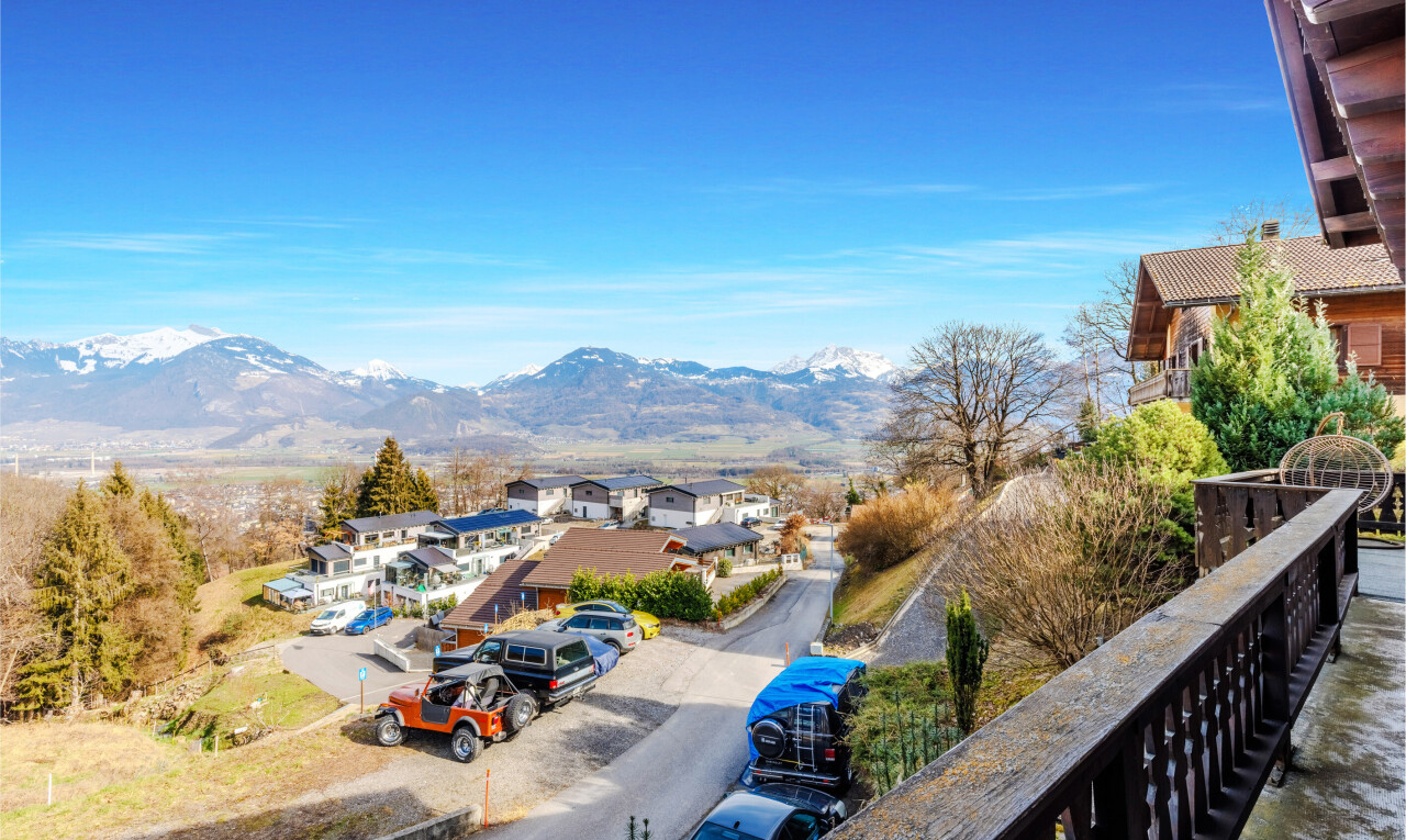 balcony featuring a mountain view and a residential view