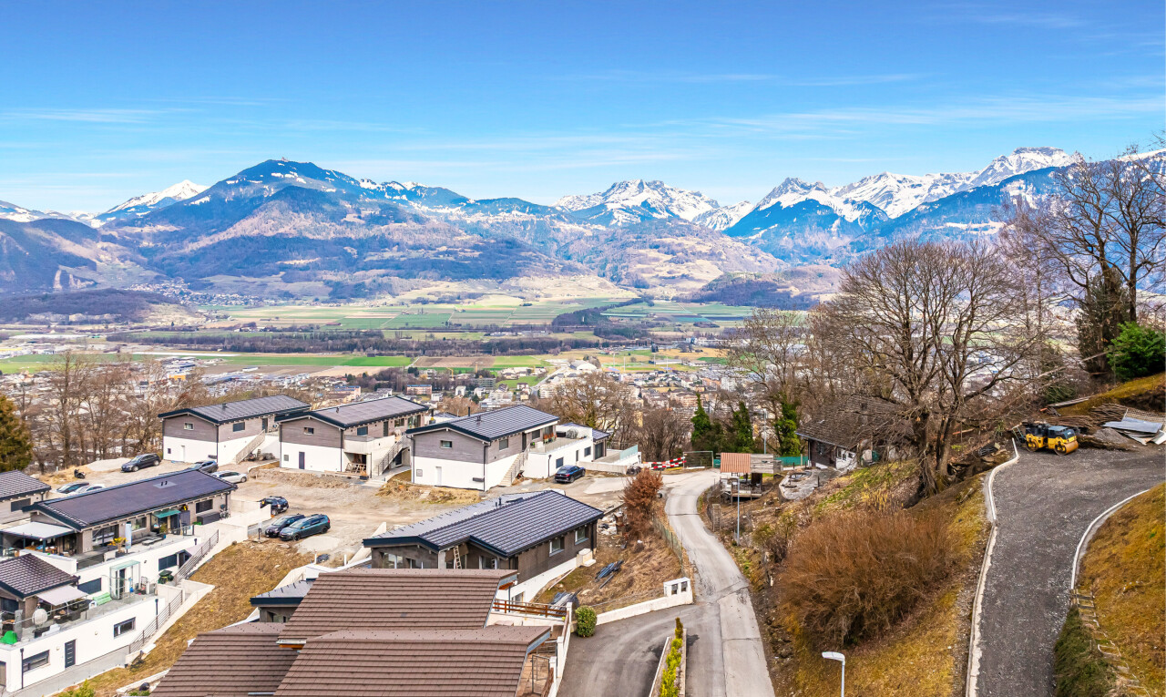 view of mountain background with nearby suburban area