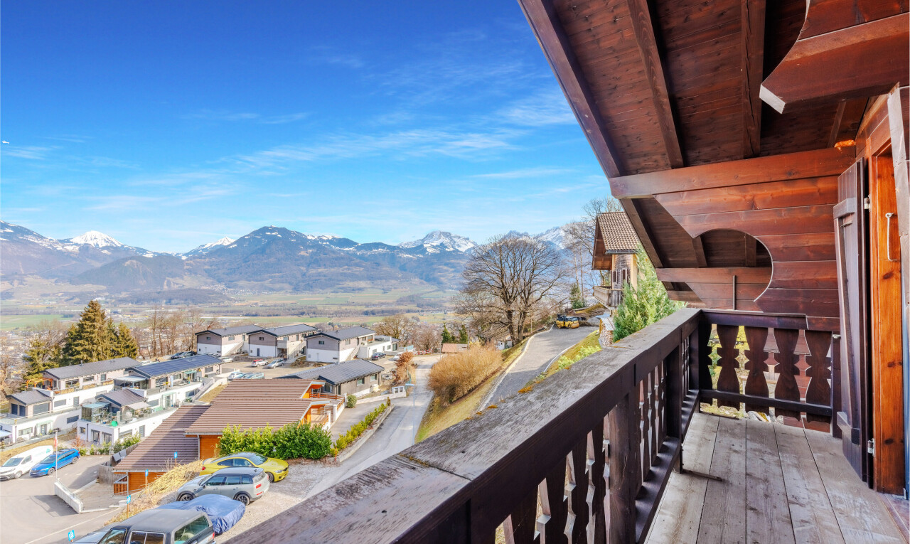 balcony with a mountain view and a residential view