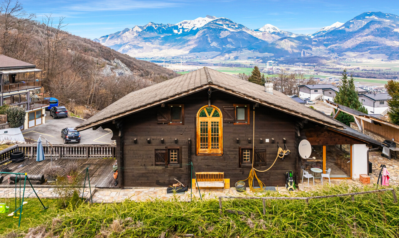 view of home featuring a mountain view and a patio