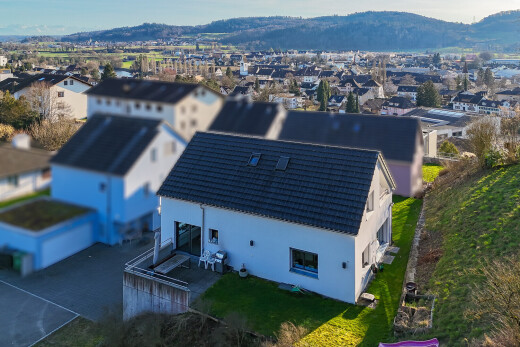 view of property featuring a residential view, a patio area, a mountain view, and stucco siding