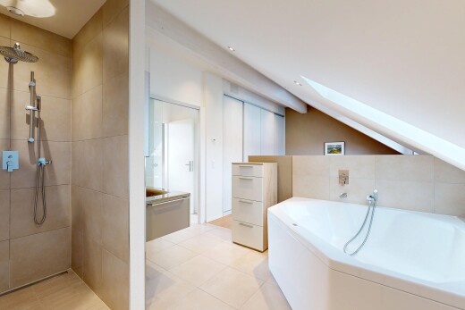 bathroom with a bath, walk in shower, a skylight, washer / clothes dryer, and vanity