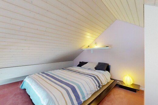 room featuring wood ceiling, lofted ceiling, and carpet flooring