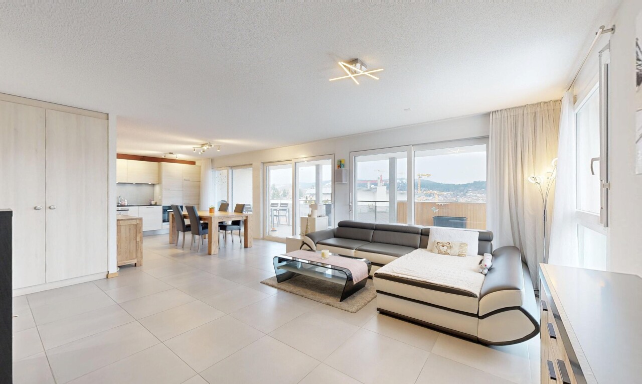 living / dining room with plenty of natural light and light tile patterned flooring